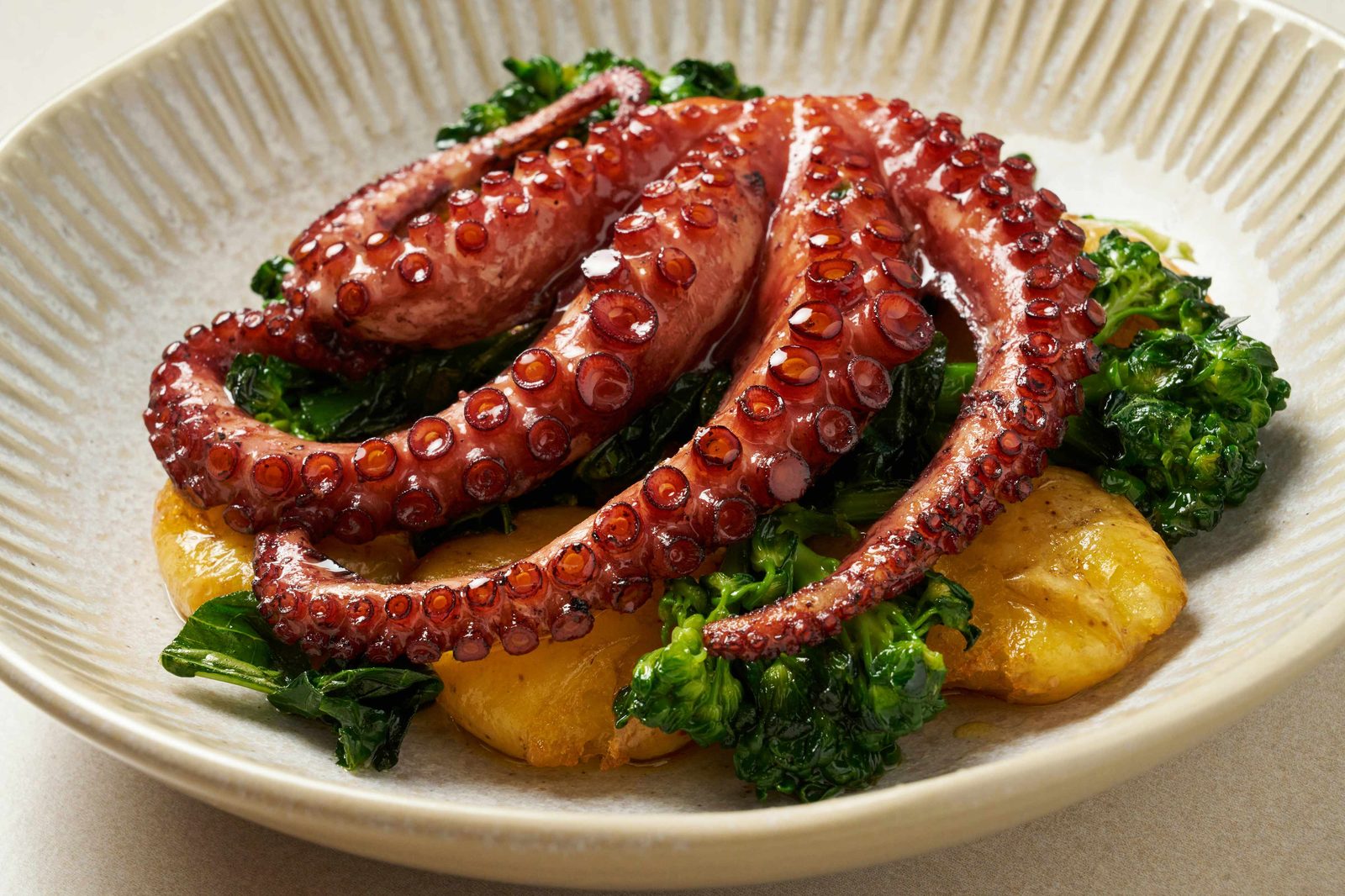 Charred octopus with broccolini and potatoes